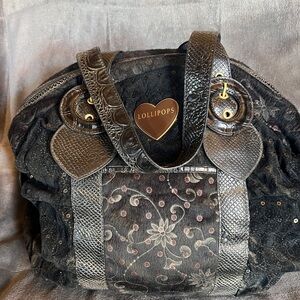 Black Shoulder Bag with Heart Accents and Gold Hardware